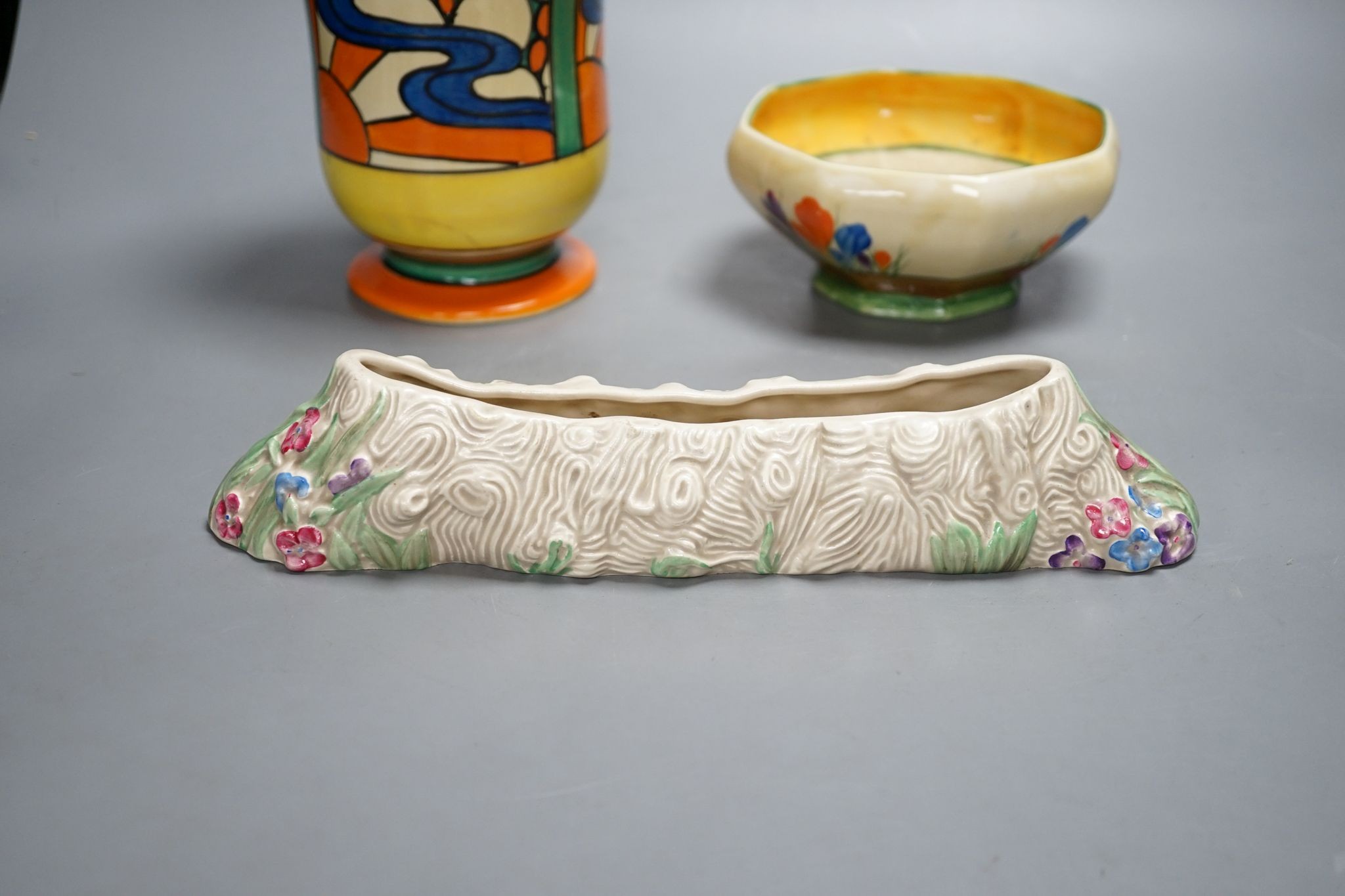 A Clarice Cliff Fantasque vase and two other Clarice cliff items